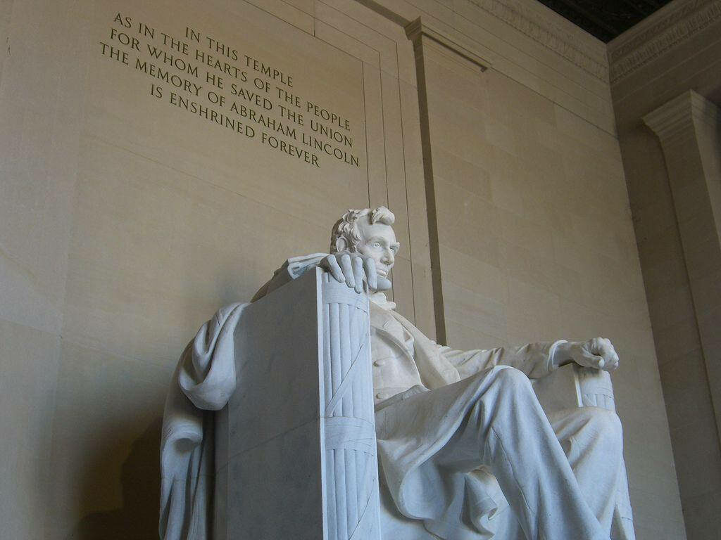 Lincoln Monument statue with seated Abraham Lincoln and memorial inscription wallpaper background