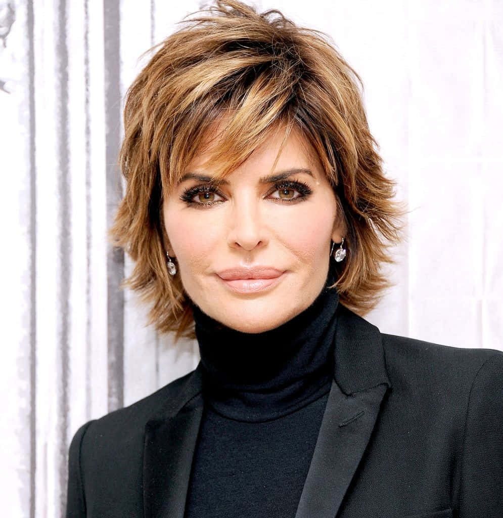Lisa Rinna portrait short textured shag haircut black turtleneck blazer bright minimalist background Wallpaper