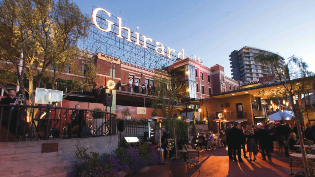 Vibrant Ghirardelli Square: Iconic Architecture & Outdoor Seating Wallpaper