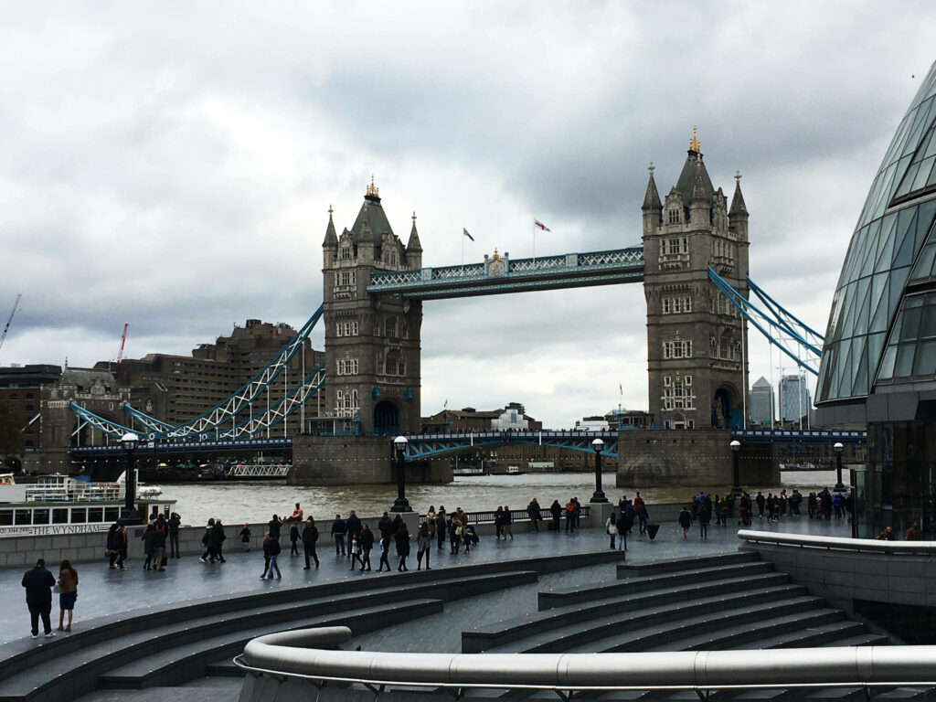 Tourists Explore Iconic Tower Bridge: London Cityscape Wallpaper
