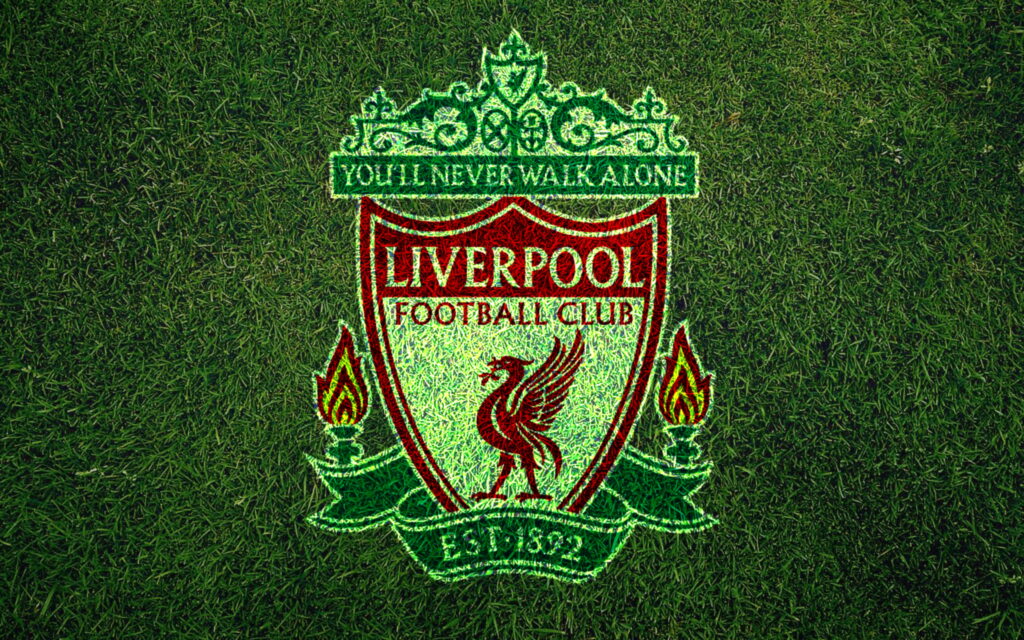 Liverpool FC Emblem on Lush Green Fields: HD Wallpaper Representing Eternal Passion for Football