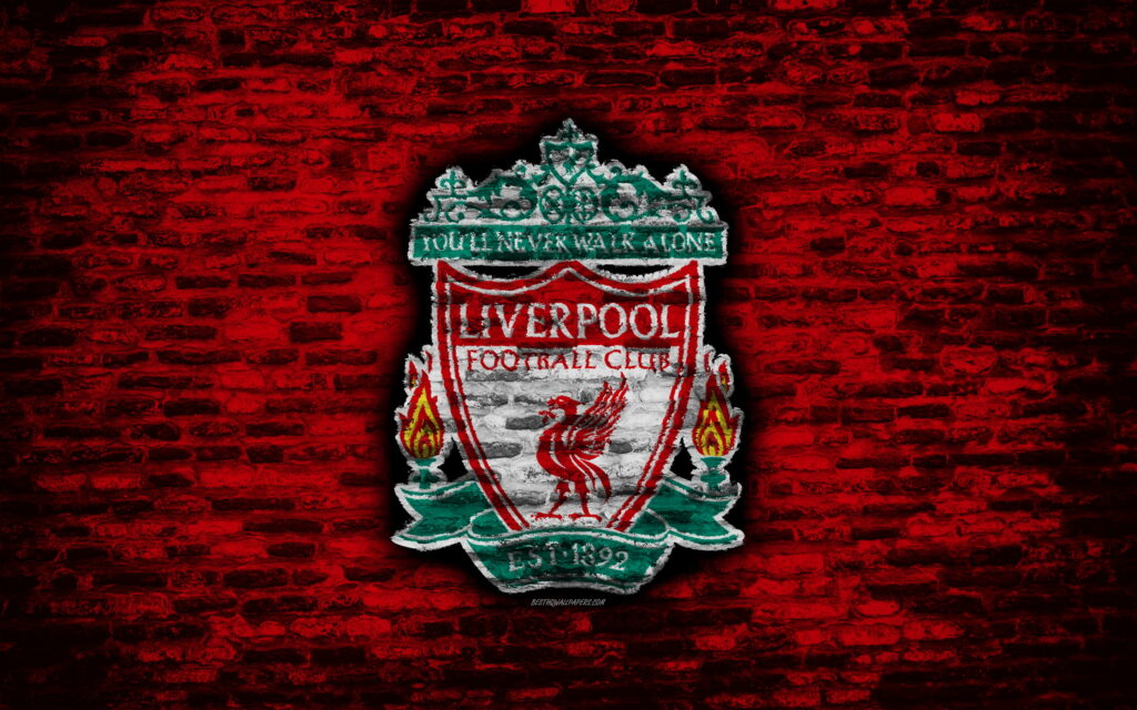 The Emblematic Reds: Liverpool FC's Iconic Logo Immersed in Vibrant Brick Texture Wallpaper