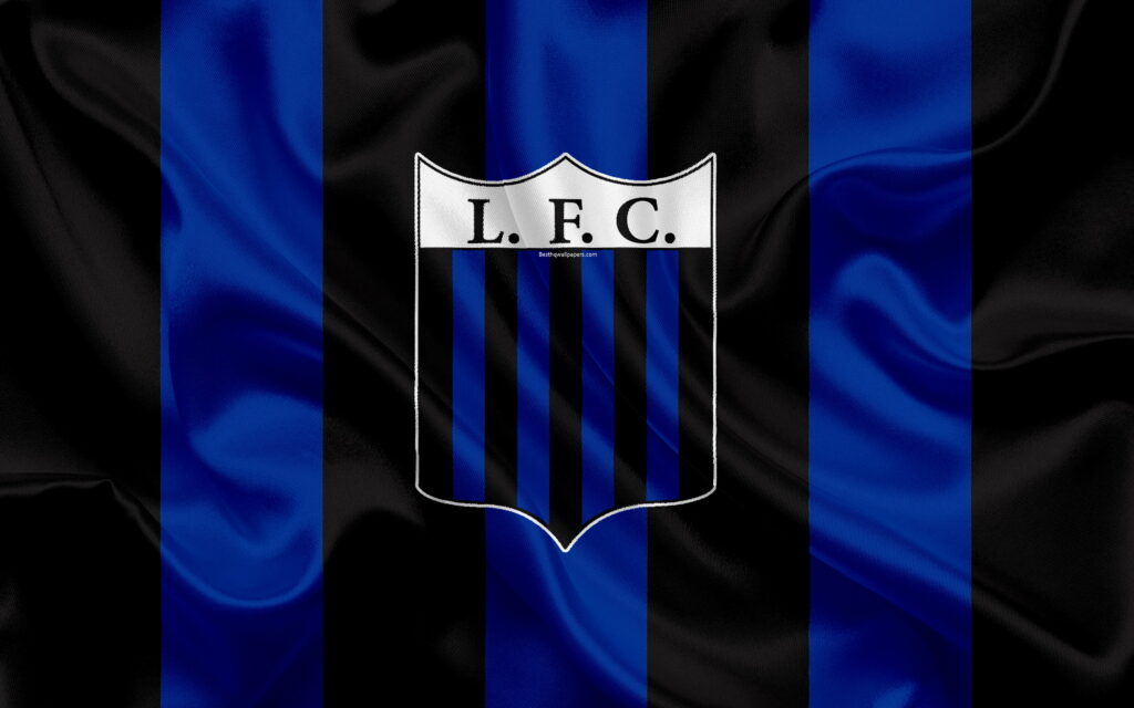 Liverpool Montevideo FC Emblem: A Majestic Silk-textured Logo unfurled on a Striking Blue-Black Flag - Stunning HD Wallpaper