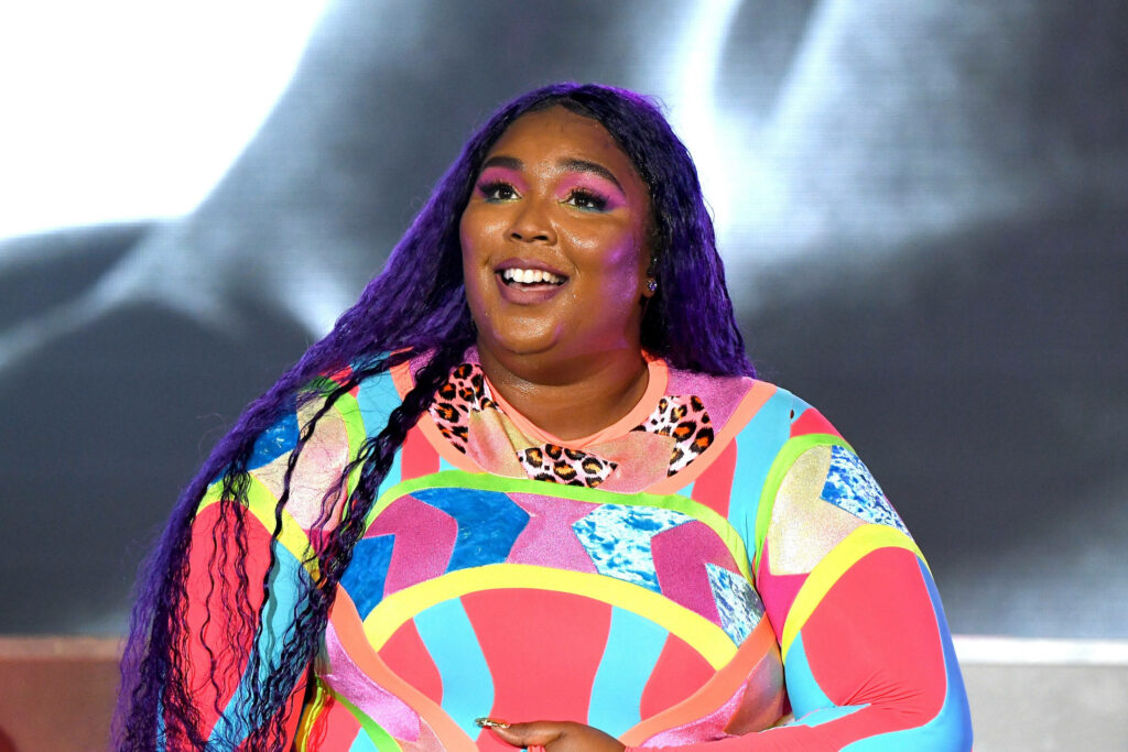 Vibrant Lizzo: Colorful Outfit & Stunning Purple Hair Wallpaper