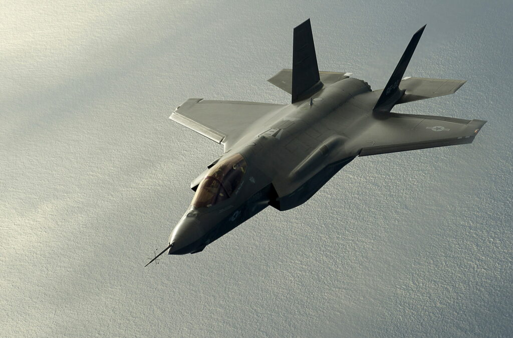 Lockheed F-35 Lightning II jet flying over ocean 4K HD military wallpaper background