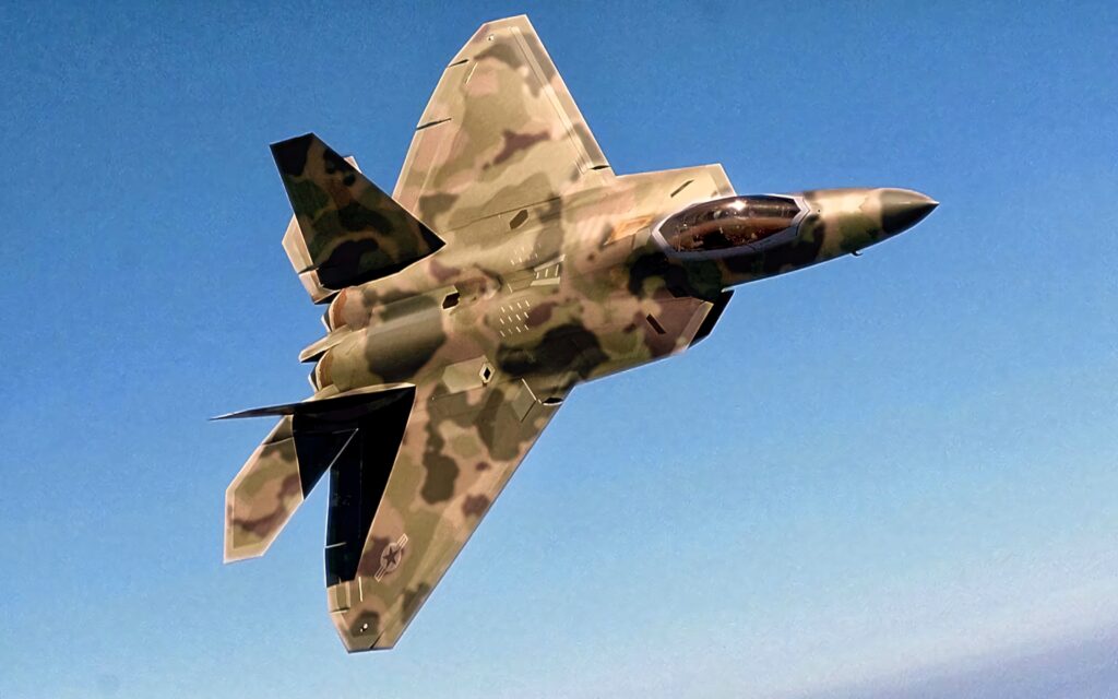 Lockheed Martin F-22 Raptor soaring in clear sky showcasing stealth design and camouflage paint Wallpaper