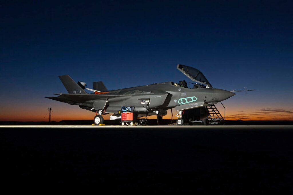 Lockheed Martin F-35 fighter jet on runway at dusk showcasing stealth design and advanced cockpit Wallpaper