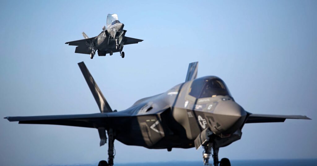 Two Lockheed Martin F-35 fighter jets in flight showcasing advanced stealth design and technology Wallpaper