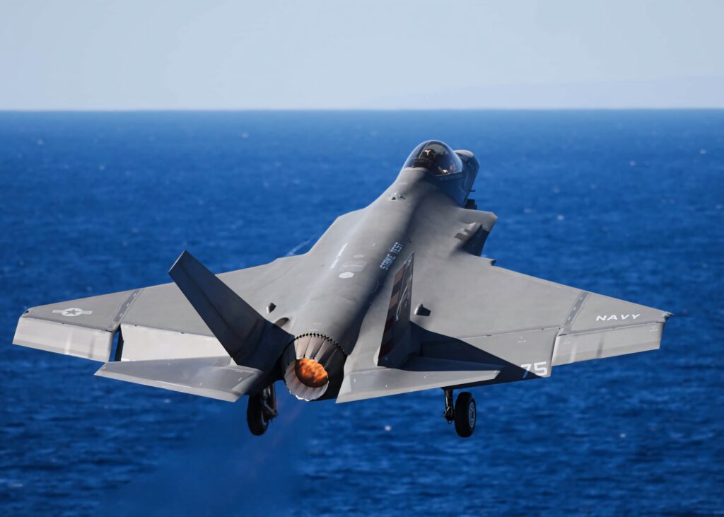 Lockheed Martin F-35 stealth fighter jet soaring over deep blue ocean with clear sky wallpaper