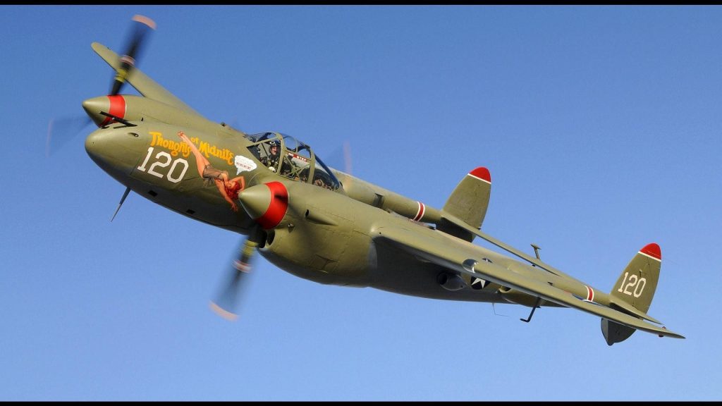 Lockheed P-38 Lightning WWII fighter plane mid-flight blue sky Thoughts of Midnite nose art Wallpaper