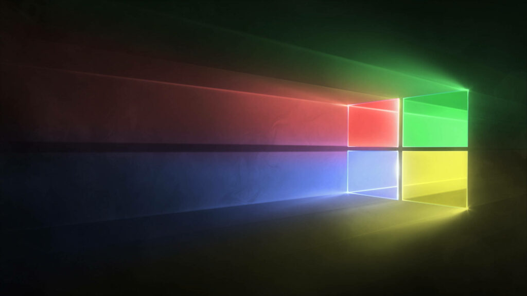 Glittering Logo: Exquisite Black Windows 10 HD Desktop Wallpaper featuring Illuminated Official Colors on Dark Backdrop