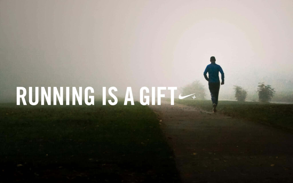 Foggy Path Adventure: Lone Runner in Blue Jacket Embraces Joy Wallpaper