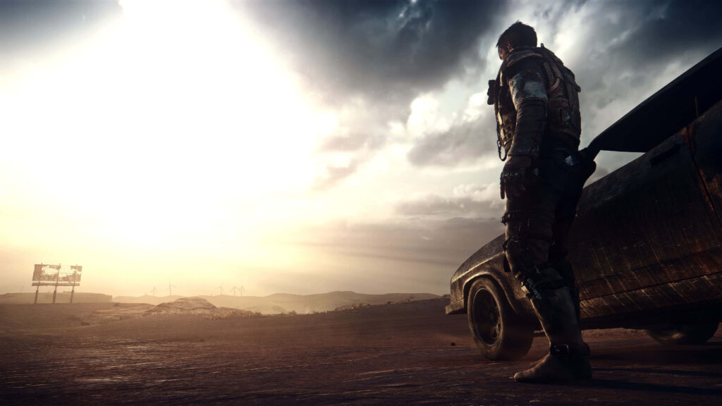 Lone survivor beside rugged car under dramatic sky in barren Mad Max style post-apocalyptic wasteland Wallpaper