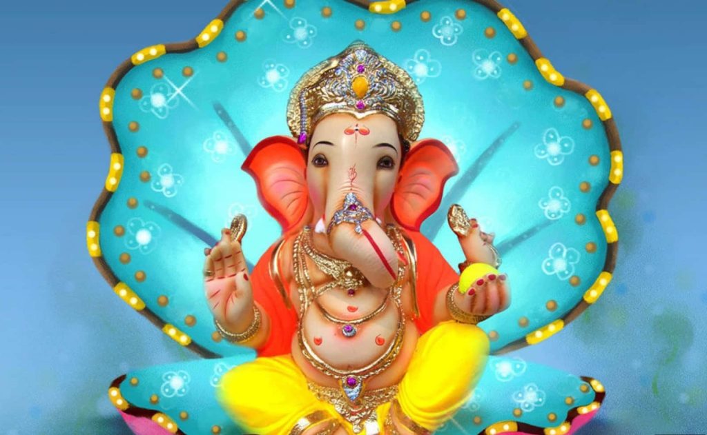 Lord Ganesha seated with blue shell backdrop colorful festive attire spiritual wallpaper background