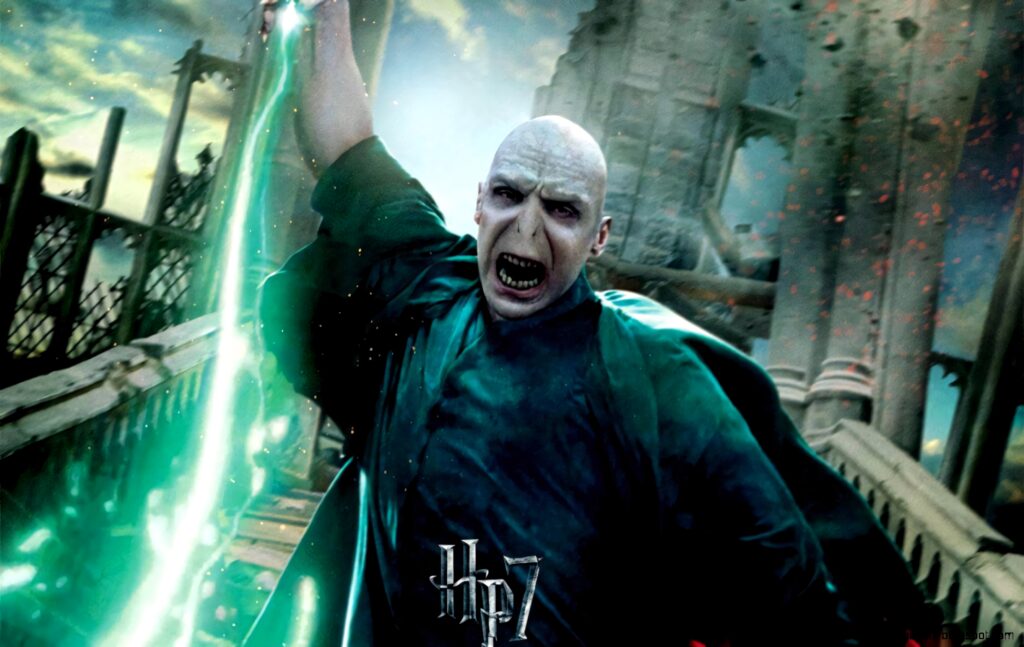 Lord Voldemort casting Avada Kedavra spell with green magic light Harry Potter intense scene Wallpaper