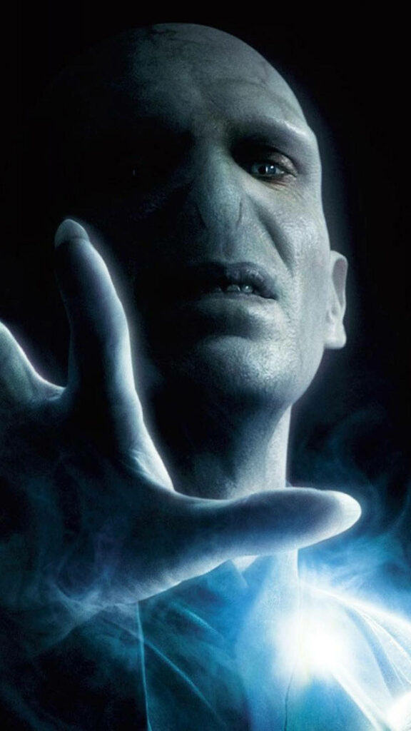 Lord Voldemort casting glowing blue magic spell dark powerful fantasy wallpaper background