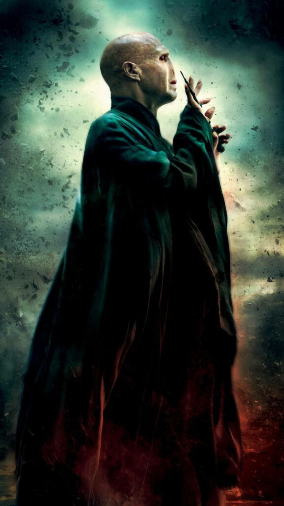 Lord Voldemort casting spell in red and green mist dark wizard dramatic wallpaper background