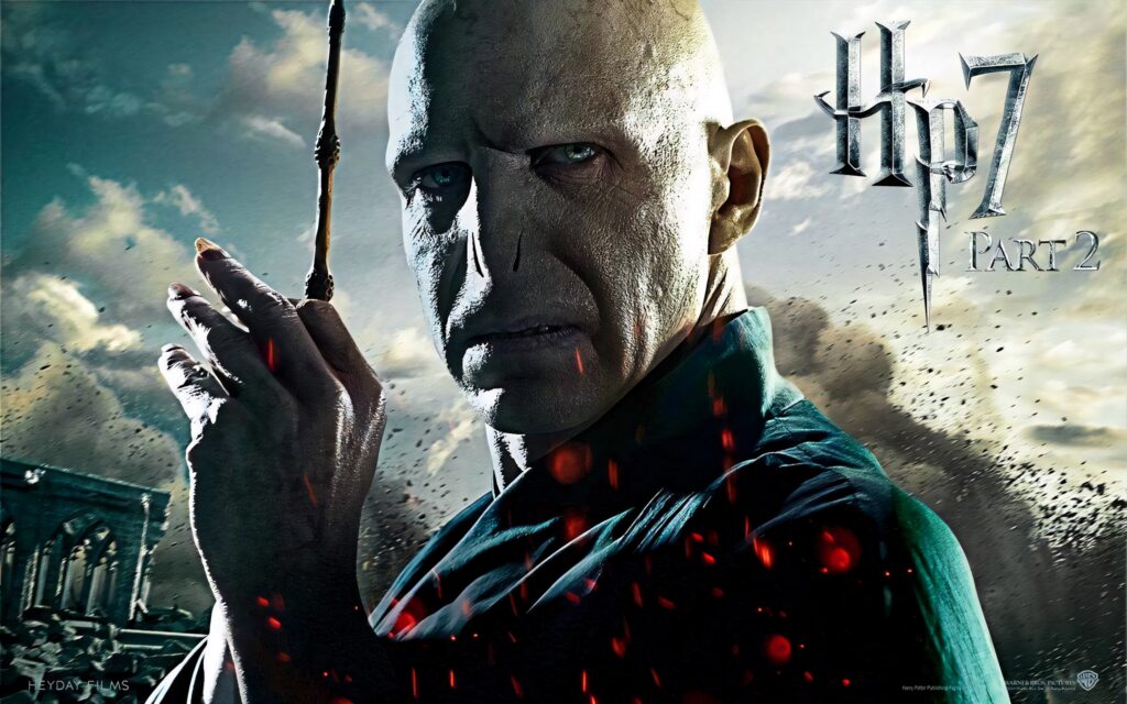 Lord Voldemort menacingly raises wand against dramatic cloudy sky dark intense Deathly Hallows Wallpaper