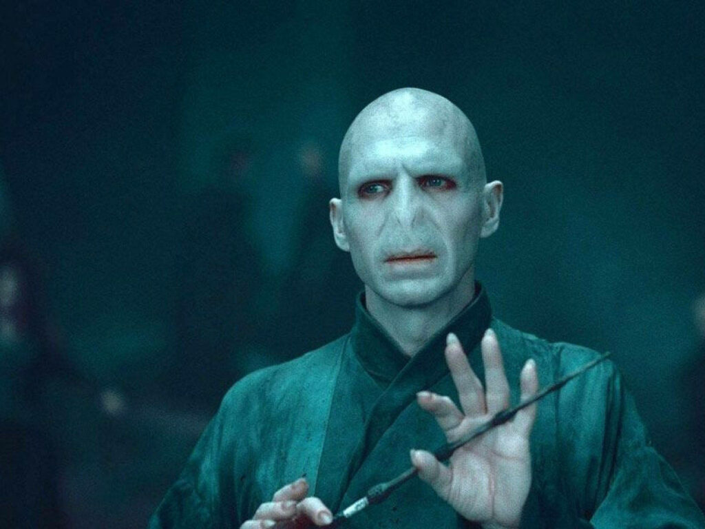 Lord Voldemort raising wand dark magic intense wallpaper background fantasy villain