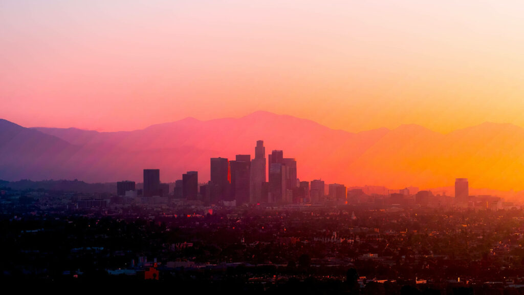 Vibrant Majesty: Captivating Aerial Vista of Los Angeles 4k Skyline Gently Embraced by Colorful Atmosphere Wallpaper