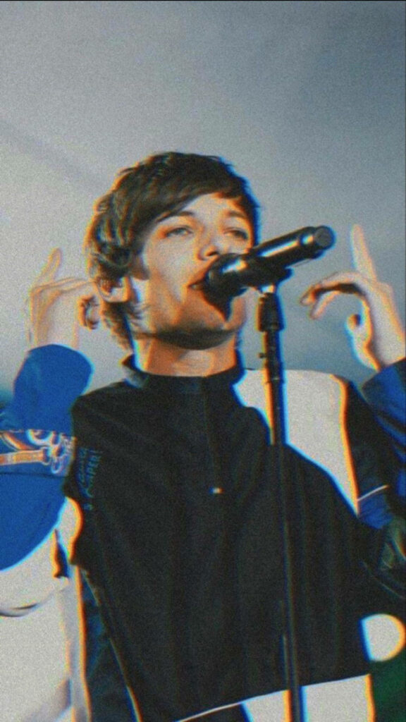 Louis Tomlinson's Electrifying Performance in Distinct Color Block Jacket Wallpaper