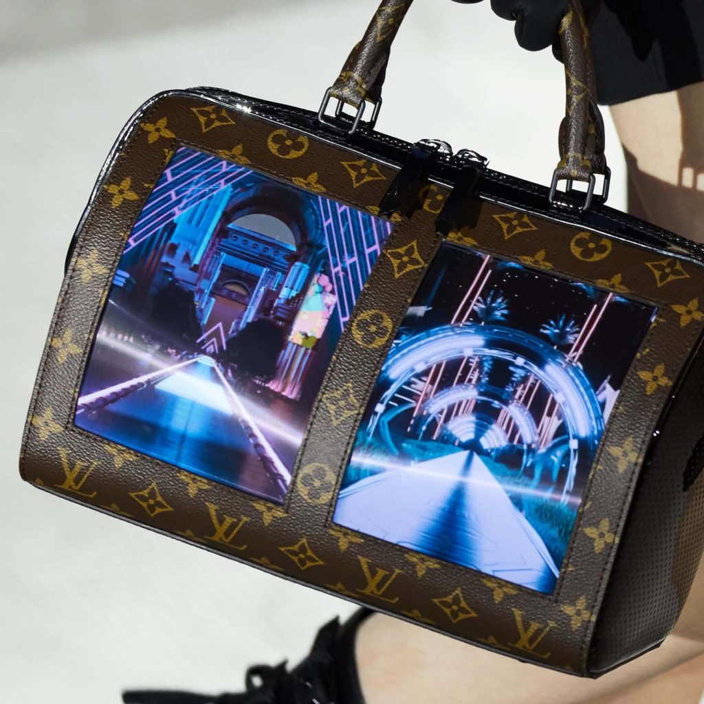 Louis Vuitton flexible display handbag with monogram and dual blue OLED screens wallpaper background