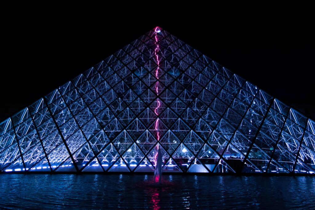 Stunning Louvre Pyramid Wallpaper: Night Reflection in Water