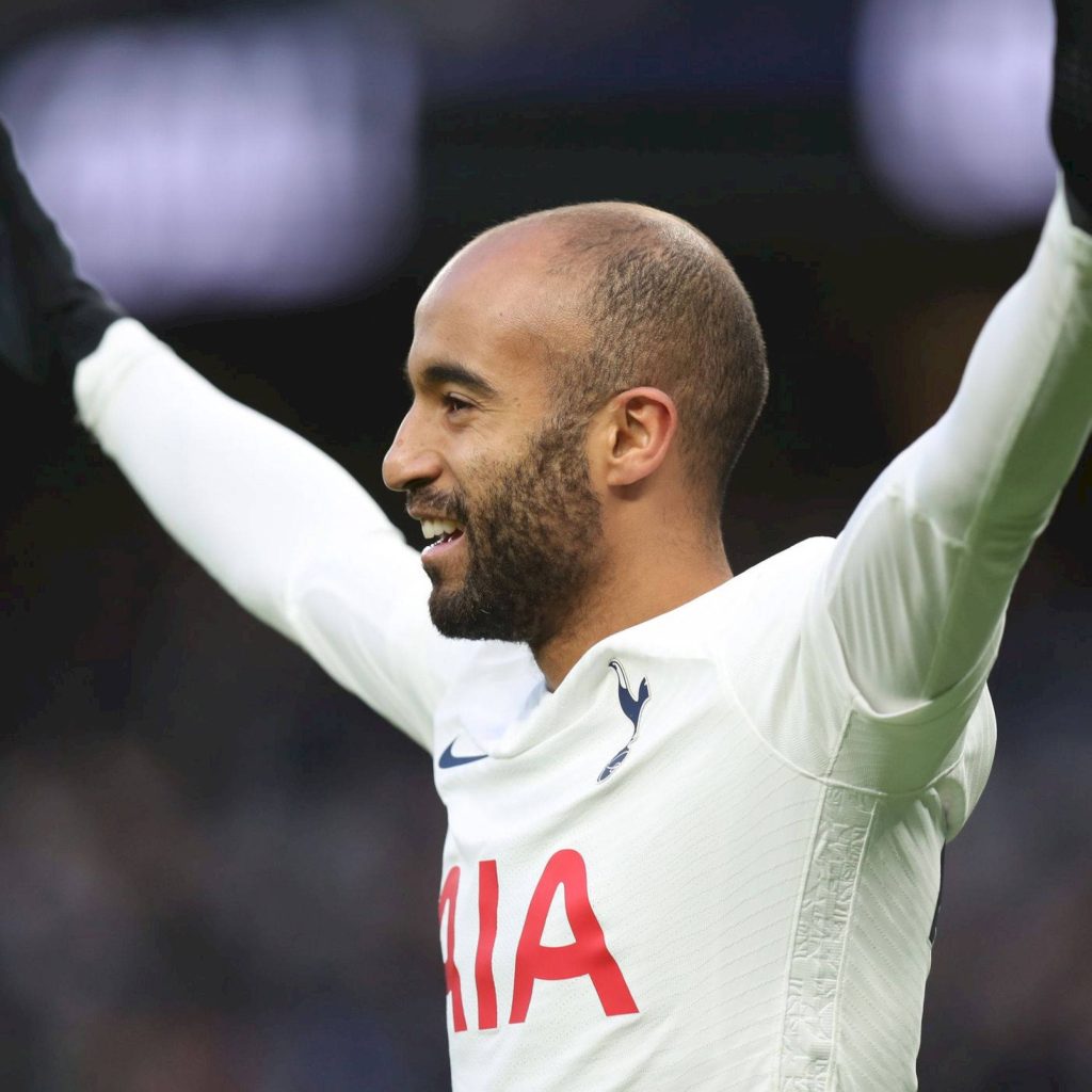 Lucas Moura celebrating with arms raised in white Tottenham Hotspur kit side profile wallpaper