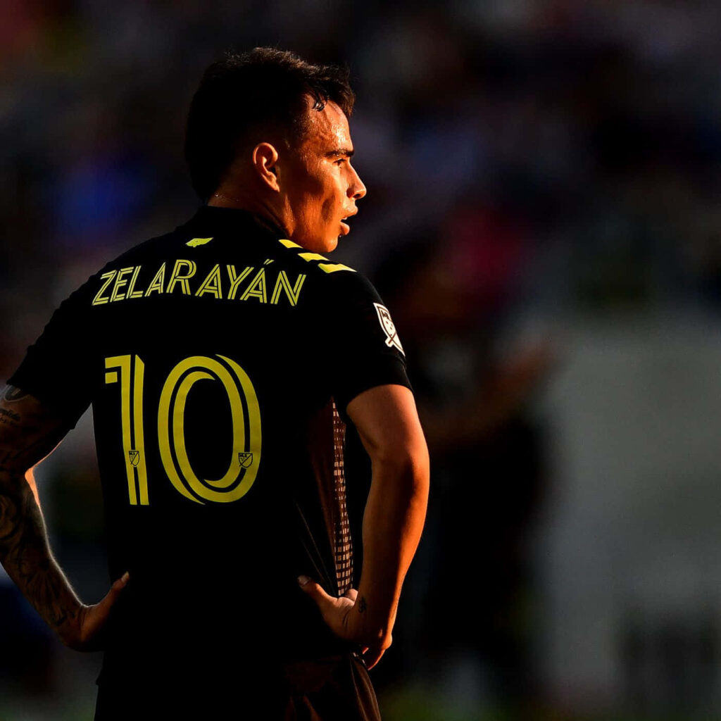 Lucas Zelarayan in Columbus Crew jersey number ten spotlighted dark background soccer player Wallpaper