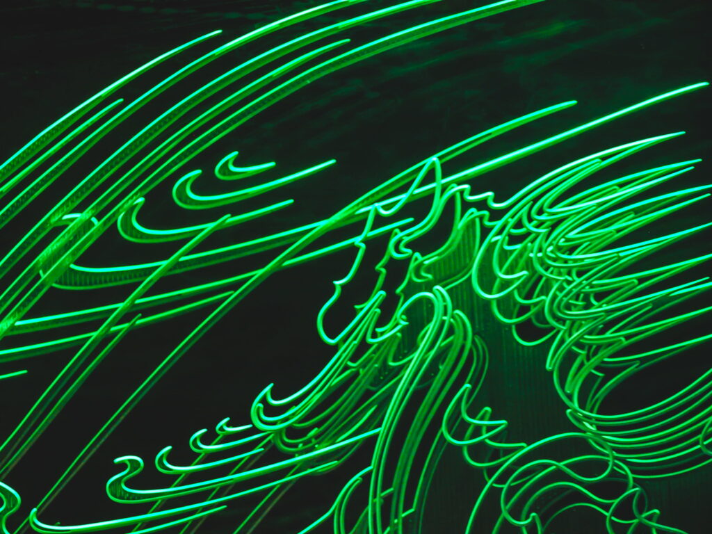 The Luminous Enigma: A Captivating Neon Abstract in Vivid Green Wallpaper