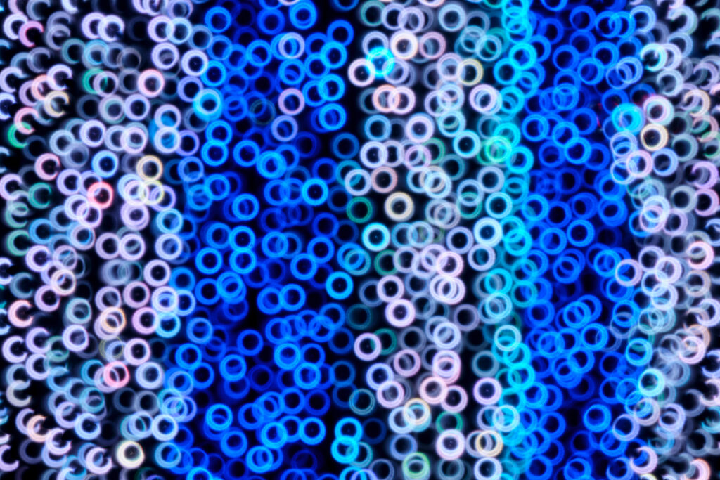Mesmerizing Blue Abstract Wallpaper with Luminous Interconnected Rings
