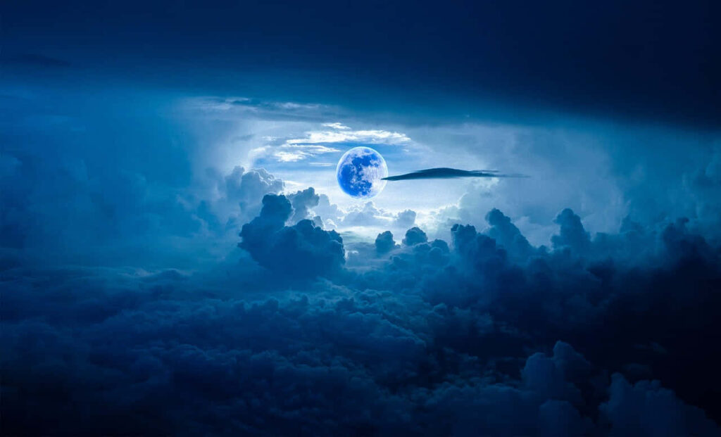 Luminous Blue Moon Wallpaper: Tranquil Night Sky Background