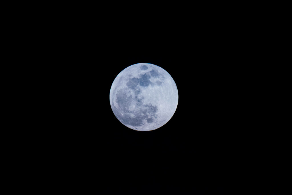 Luminous Full Moon Wallpaper Against Deep Dark Sky Background