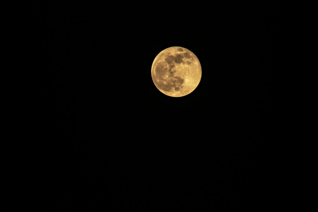Luminous Full Moon Wallpaper: Serene Night Sky Background Art