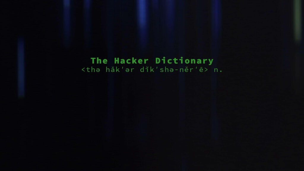 Glowing Hues: Illuminated The Hacker Dictionary with Phonetic Notation on Mysterious Background Wallpaper