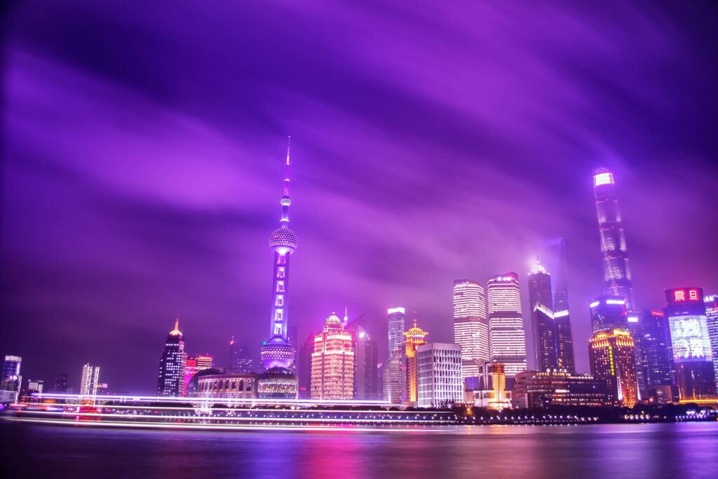 Luminescent Twilight: Vibrant Purple Glow Embraces the Nocturnal Cityscape Wallpaper