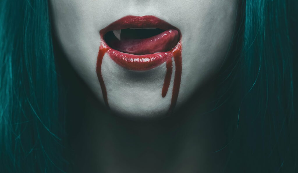 Seductive Fangs: A Woman's Tempting Lips Enveloped in Bloody Passion - 4K Wallpaper