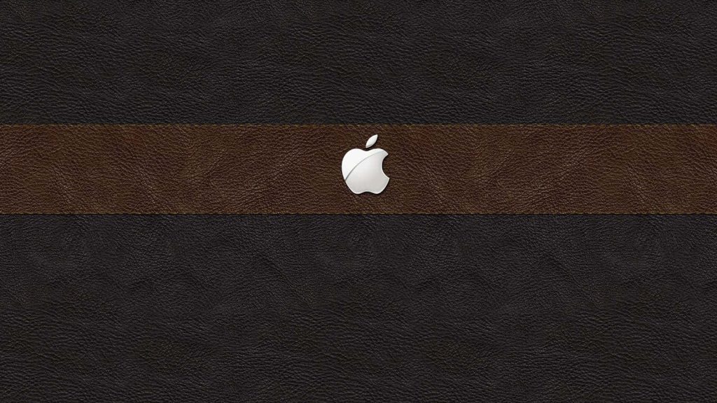 Luxurious Apple logo wallpaper on tri-textured black and brown leather for sleek style