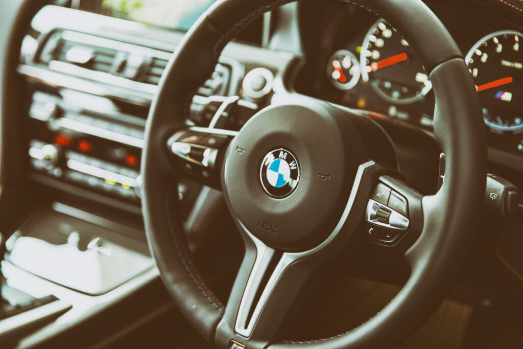 Luxury BMW M6 Interior: Sleek Steering Wheel & High-Tech Dashboard Wallpaper