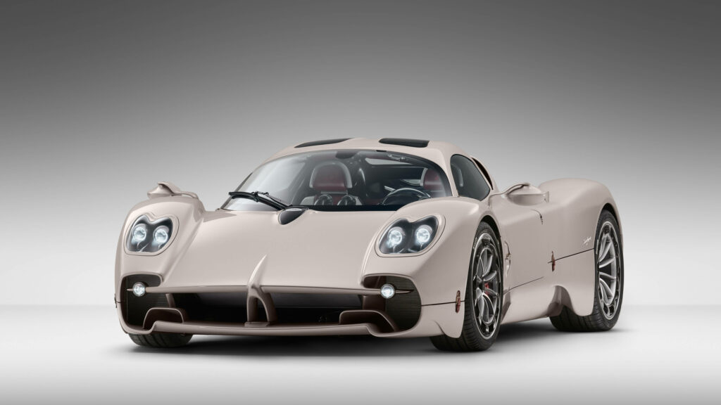 Luxurious beige sports car with sleek design and detailed headlights on minimalist gradient background Wallpaper