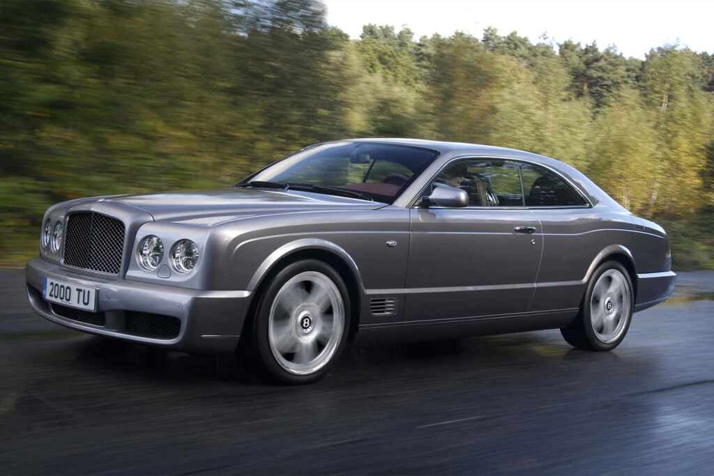 Bentley Brooklands Coupe Gliding Along a Scenic Drive in Exquisite High-Resolution Wallpaper