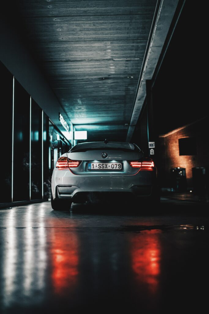 Luxurious Car Wallpaper: Neon Urban Backdrop & Sleek Design