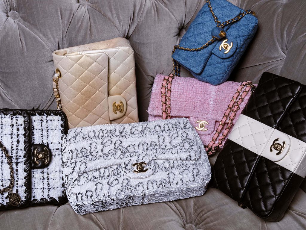 Chanel Flap Handbags wallpaper with iconic tweed denim sequined bags on gray sofa background
