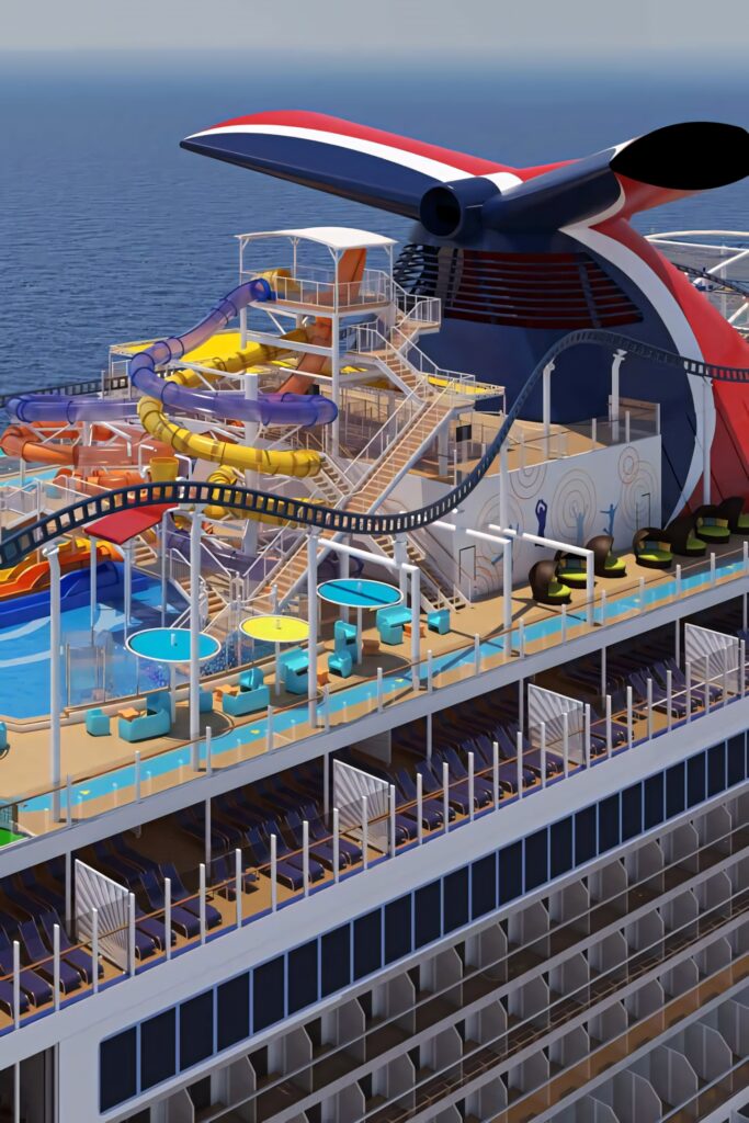 Vibrant cruise ship deck with colorful water slides pool roller coaster on calm blue sea Wallpaper
