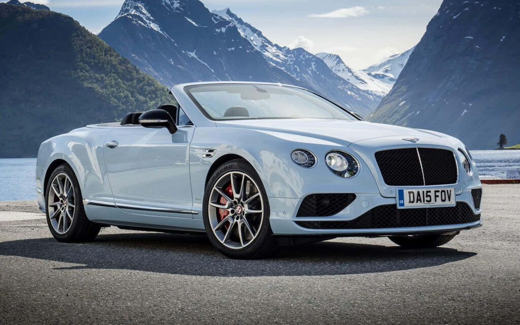 Blue Bentley Continental GT Convertible on the Open Road Wallpaper
