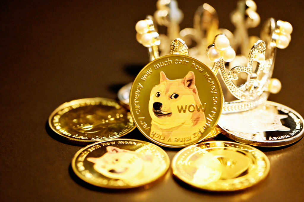 Shiny gold Dogecoin tokens with Shiba Inu face around pearl crown on dark luxury crypto wallpaper