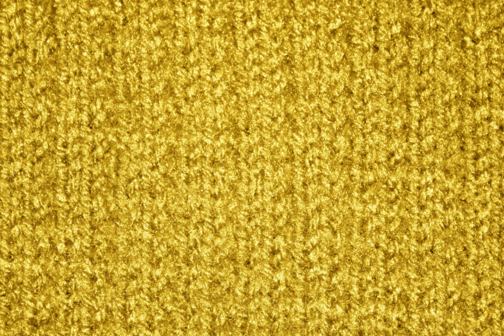 Luxurious Gold Knit Pattern Texture: Intricate Wallpaper Background