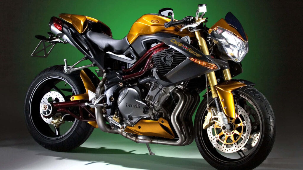 Luxurious Gold Motorcycle Wallpaper with Green Lighting Background