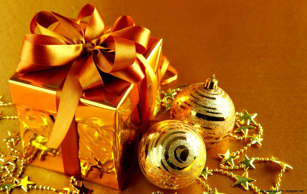 Elegant Golden Christmas Gift with Sparkling Ornaments & Decorations Wallpaper