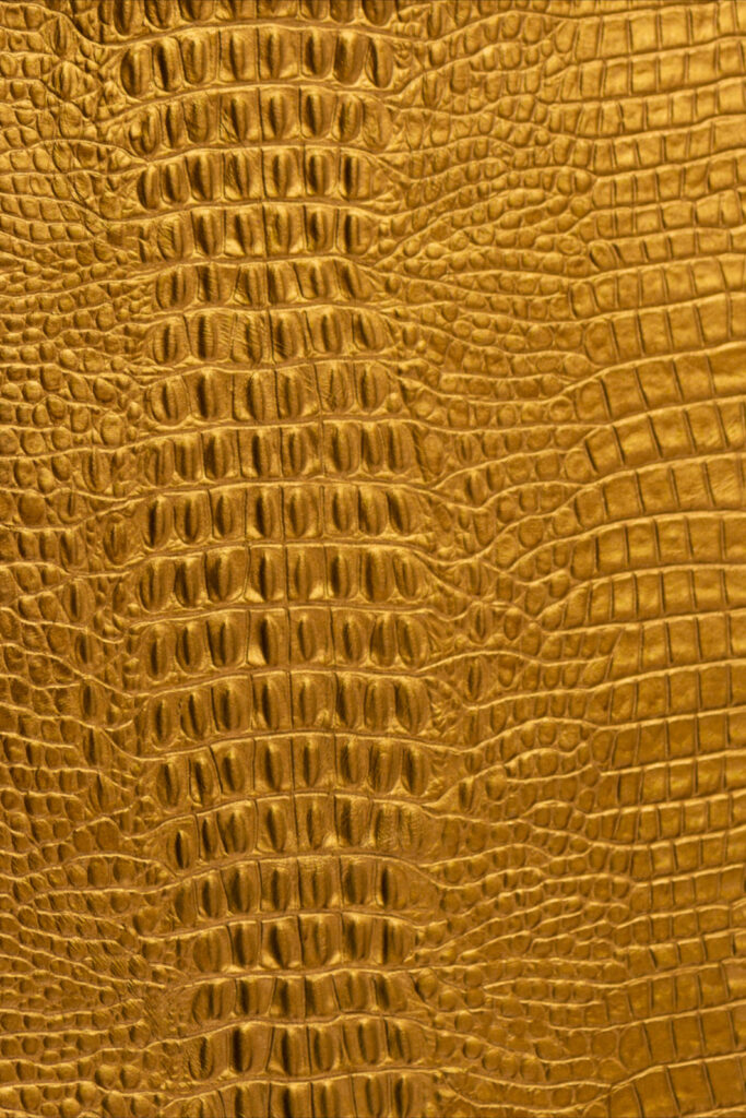 Luxurious Golden Crocodile Leather Wallpaper Background